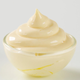Mayonnaise in a glass bowl on white background